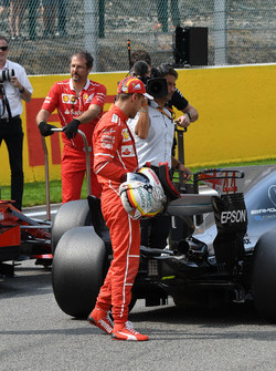 Sebastian Vettel, Ferrari celebrates and observes the car of Lewis Hamilton, Mercedes-Benz F1 W08 in parc ferme