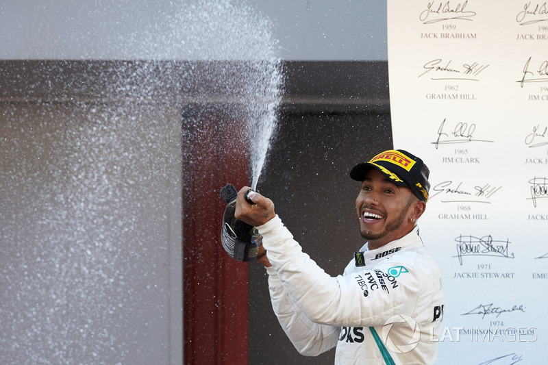 Lewis Hamilton, Mercedes AMG F1, 1st position, sprays Champagne on the podium