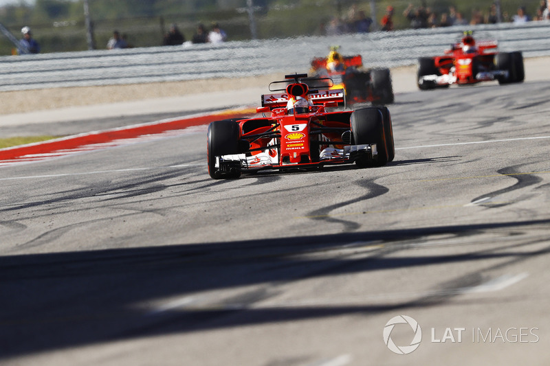 Sebastian Vettel, Ferrari SF70H, crosses the line ahead of Max Verstappen, Red Bull Racing RB13, Kimi Raikkonen, Ferrari SF70H