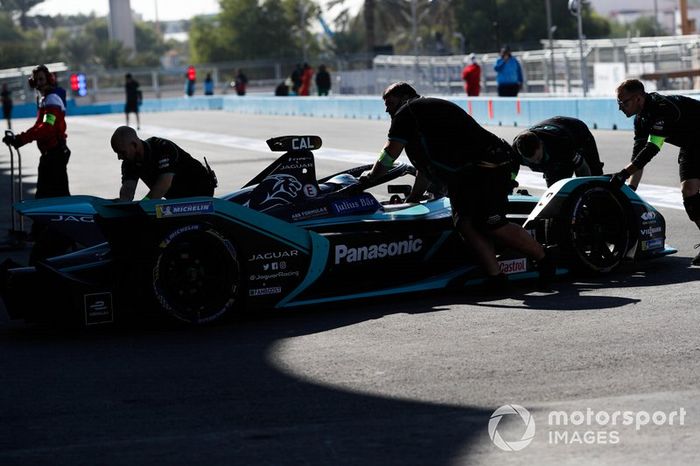 Mechanics push James Calado, Jaguar Racing, Jaguar I-Type 4 back into the garage