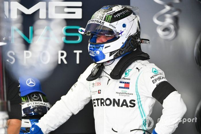Valtteri Bottas, Mercedes AMG F1 in the garage with a black arm band on in tribute of Niki Lauda