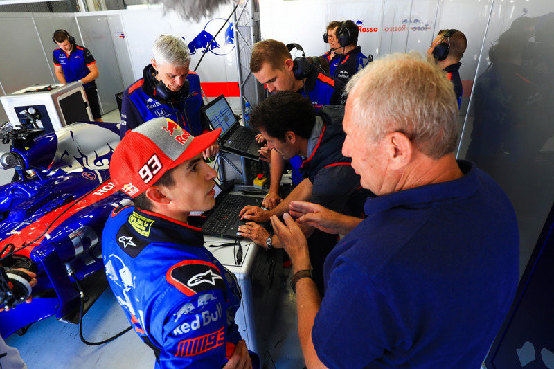 Marc Marquez, tests the Toro Rosso F1 car with Mark Webber watching