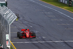 Sebastian Vettel, Ferrari SF71H, takes the chequered flag ahead of Lewis Hamilton, Mercedes AMG F1 W09