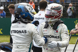 Valtteri Bottas, Mercedes AMG F1, and Lewis Hamilton, Mercedes AMG F1, congratulate each other on locking out the front row