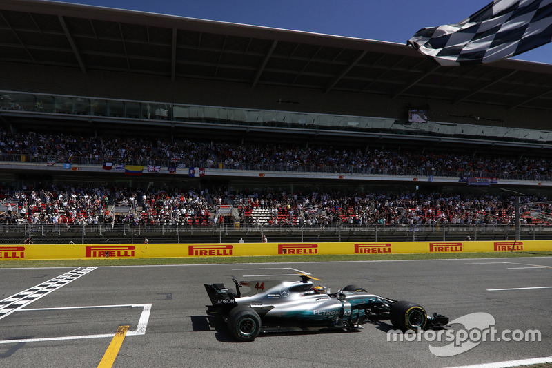 Lewis Hamilton, Mercedes AMG F1 W08, crosses the line and takes the chequered flag to win the race