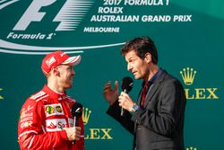 Sebastian Vettel, Ferrari, 1st Position, is interviewed by Mark Webber on the podium