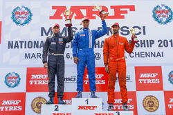 Race 1 podium: winner Karthik Tharani, second place Vikash Anand, third place Raghul Rangasamy