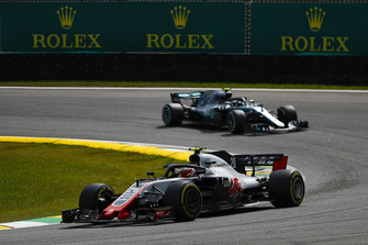 Kevin Magnussen, Haas F1 Team VF-18, leads Max Verstappen, Red Bull Racing RB14