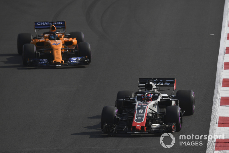 Romain Grosjean, Haas F1 Team VF-18 and Lando Norris, McLaren MCL33