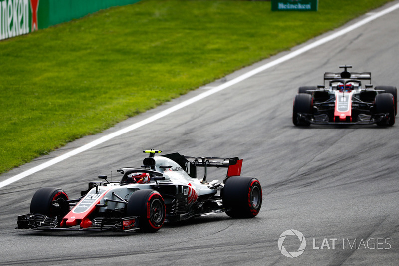 Kevin Magnussen, Haas F1 Team VF-18, leads Romain Grosjean, Haas F1 Team VF-18