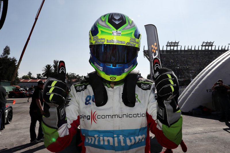 Benito Guerra celebrates after winning a race