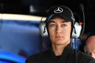 George Russell, Mercedes AMG F1 and Jean-Michel Tibi, FOM Cameraman
