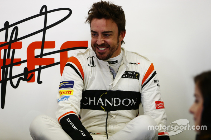 Fernando Alonso, McLaren, relaxes in the garage