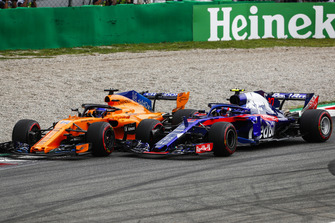 Fernando Alonso, McLaren MCL33, and Pierre Gasly, Toro Rosso STR13, go wheel-to-wheel