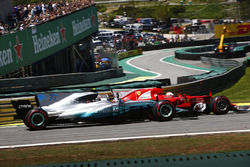 Sebastian Vettel, Ferrari SF70H, passes Valtteri Bottas, Mercedes AMG F1 W08, at the start