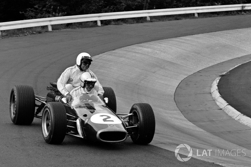 Denny Hulme gives a lift to Jack Brabham