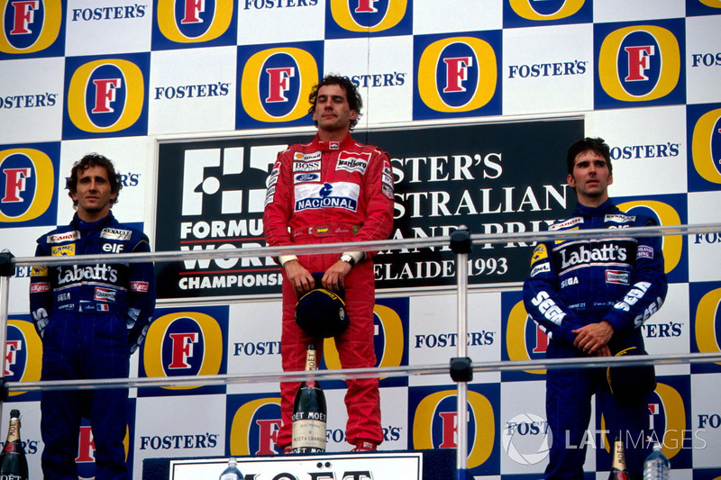 Podium: second place Alain Prost, Williams, Race winner Ayrton Senna, McLaren, third place Damon Hil