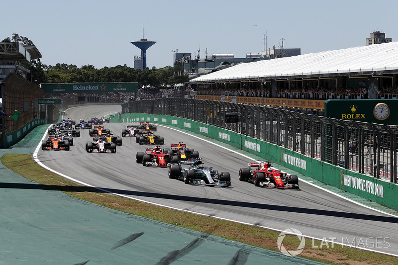 Valtteri Bottas, Mercedes-Benz F1 W08  and Sebastian Vettel, Ferrari SF70H battle at the start of th