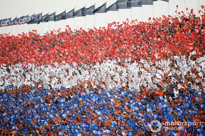Fans form the Dutch colours in a grandstand
