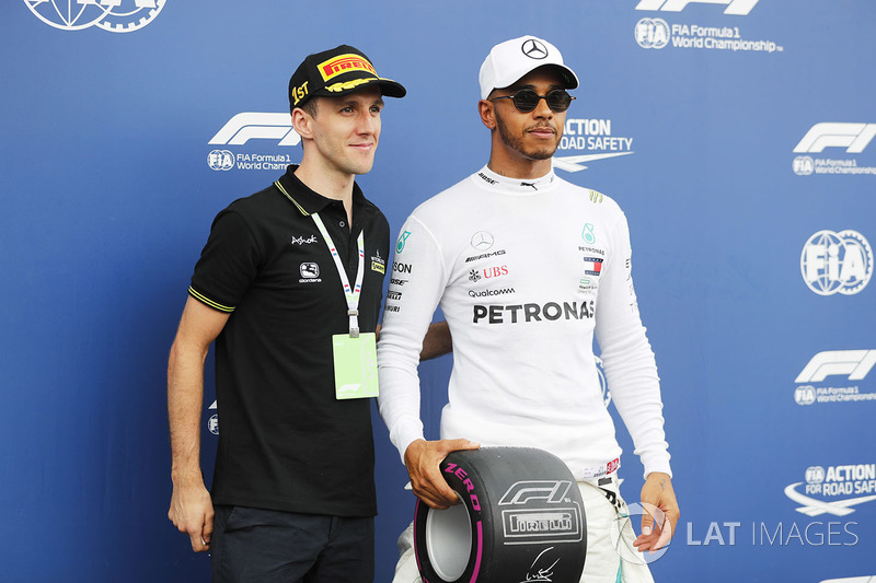 Professional Road Cyclist Simon Yates of Michelton Scott poses for a picture with Lewis Hamilton, Mercedes AMG F1 after qualifying