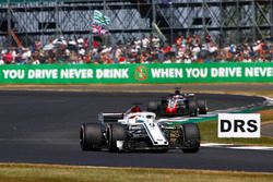 Marcus Ericsson, Sauber C37, leads Romain Grosjean, Haas F1 Team VF-18