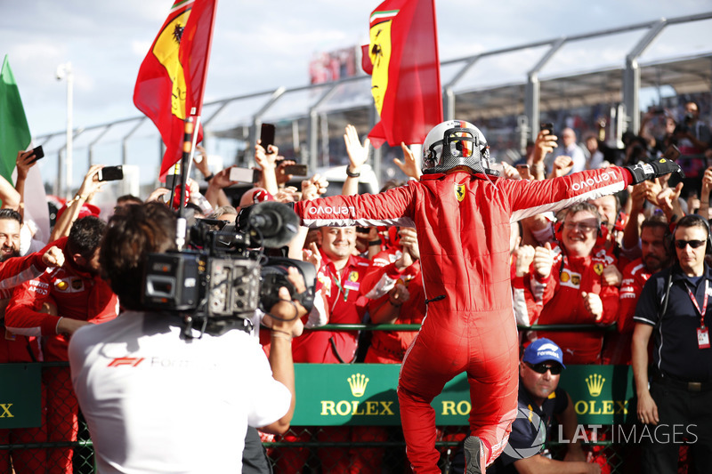 Sebastian Vettel, Ferrari SF71H, jumps for joy in parc ferme, after taking victory