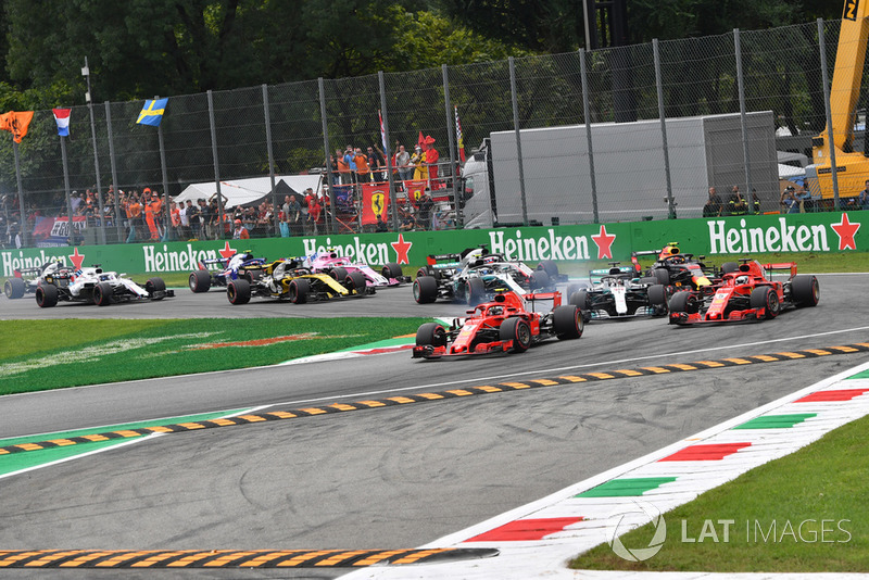 Kimi Raikkonen, Ferrari SF71H leads Sebastian Vettel, Ferrari SF71H and Lewis Hamilton, Mercedes AMG F1 W09 at the start of the race