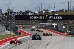 Sebastian Vettel, Ferrari SF70H, Lewis Hamilton, Mercedes AMG F1 W08, and Valtteri Bottas, Mercedes AMG F1 W08, on the first lap of the race