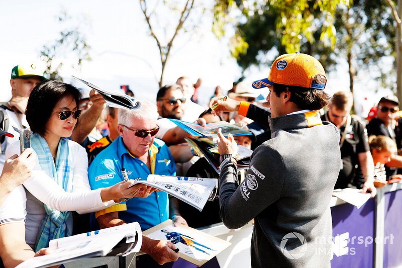 Carlos Sainz Jr., McLaren, signs autographs for fans