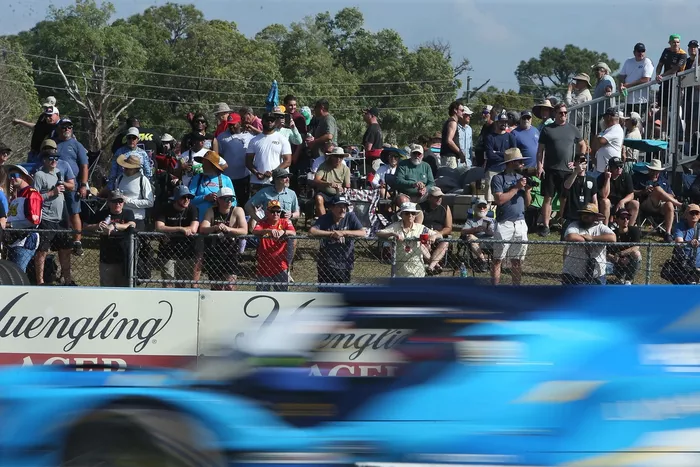 Fans watch the race action