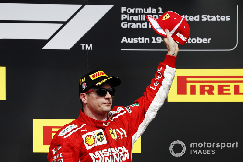 Kimi Raikkonen, Ferrari, celebrates on the podium after winning the race