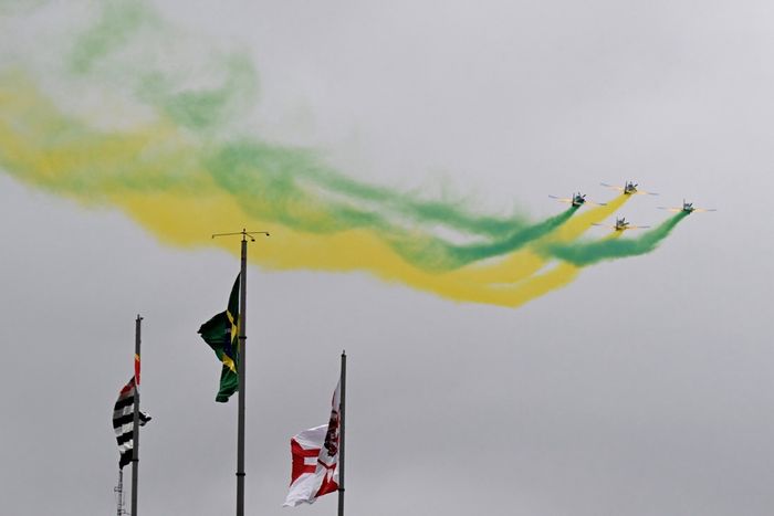 A quartet of Embraer EMB-312 Super Tucanos fly over the circuit