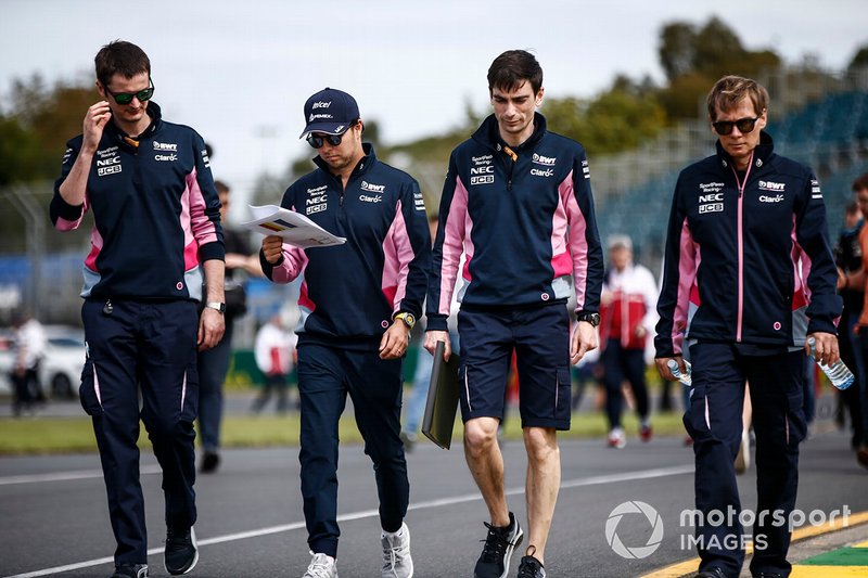 Sergio Perez, Racing Point, walks the track with his team