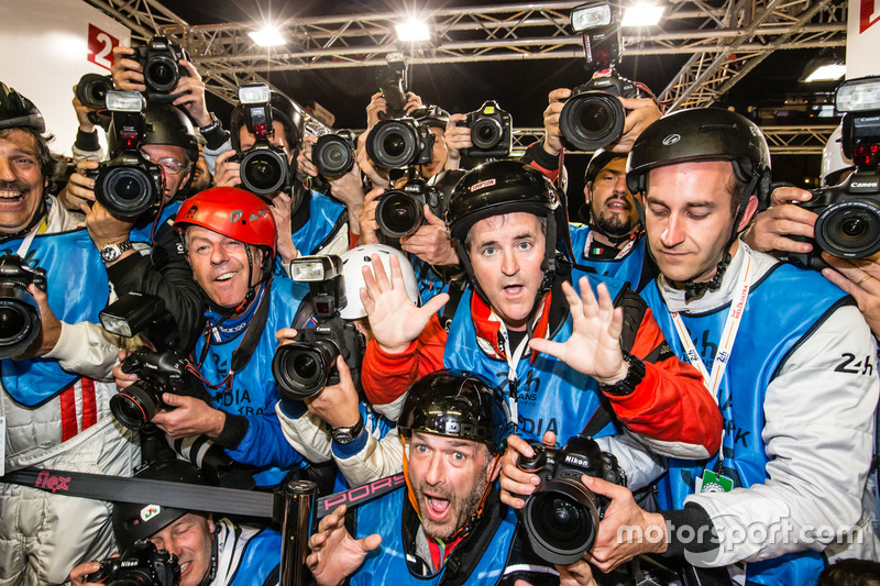 Photographers scrum for the pole celebration as shot by Romain Dumas