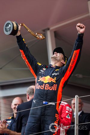 Race winner Daniel Ricciardo, Red Bull Racing celebrates on the podium with the trophy