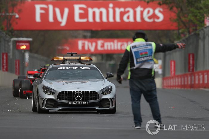 Safety car leads the field and marshal