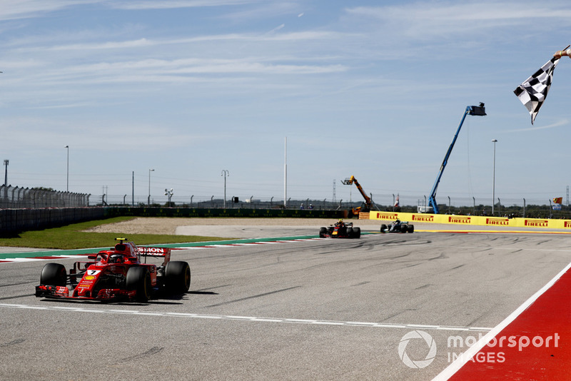 Kimi Raikkonen, Ferrari SF71H, 1st position, takes the chequered flag ahead of Max Verstappen, Red Bull Racing RB14, 2nd position, and Lewis Hamilton, Mercedes AMG F1 W09 EQ Power+, 3rd position