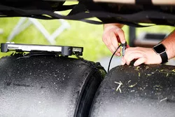 A Pirelli engineer records some tyre data