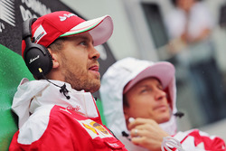 Sebastian Vettel, Ferrari with team mate Kimi Raikkonen, Ferrari on the drivers parade