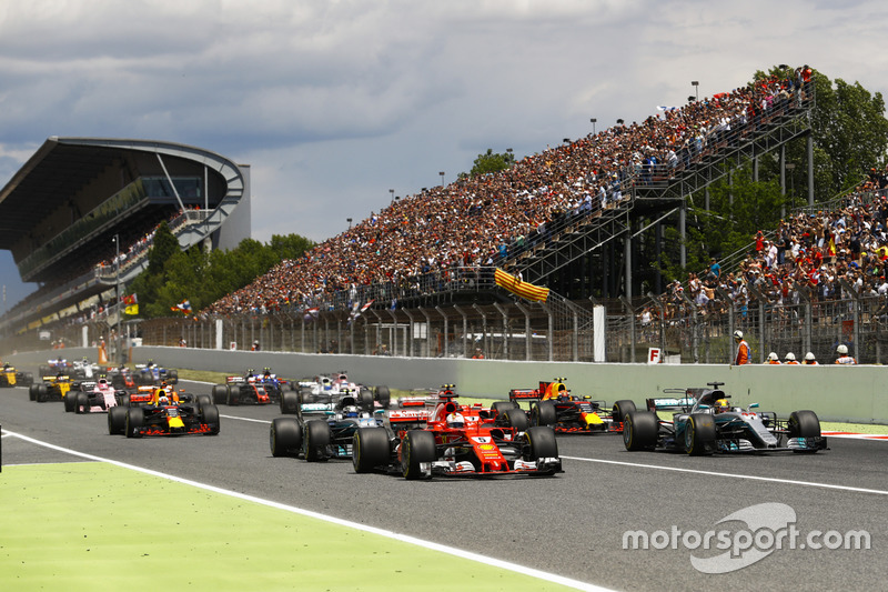 Lewis Hamilton, Mercedes AMG F1 W08, Sebastian Vettel, Ferrari SF70H, lead the field away at the start of the race