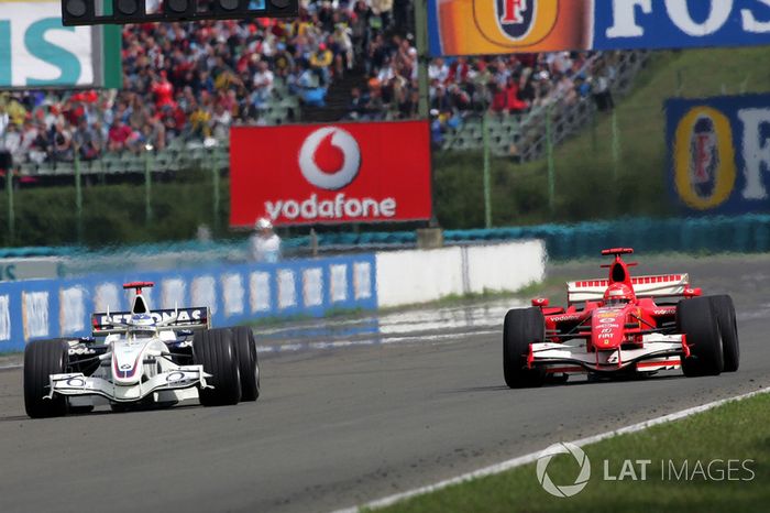 Nick Heidfeld, BMW Sauber F1.06 battles with Michael Schumacher, Ferrari 248 F1