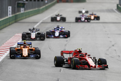 Kimi Raikkonen, Ferrari SF71H, leads Stoffel Vandoorne, McLaren MCL33 Renault, Romain Grosjean, Haas F1 Team VF-18 Ferrari, and Brendon Hartley, Toro Rosso STR13 Honda