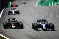 Lewis Hamilton, Mercedes AMG F1 W08, passes Romain Grosjean, Haas F1 Team VF-17