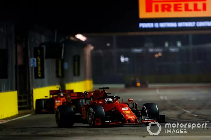 Sebastian Vettel, Ferrari SF90, leads Charles Leclerc, Ferrari SF90