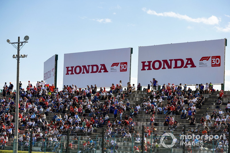 Fans in grandstands await the start