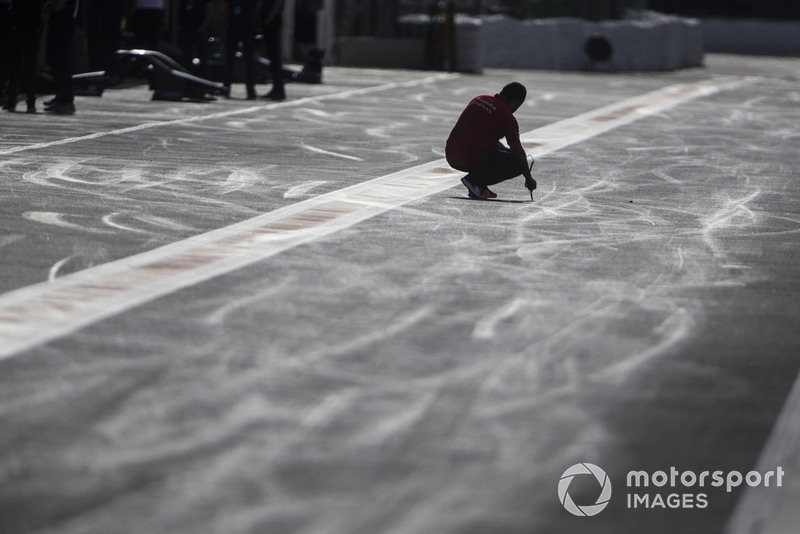 Mahindra Racing engineer in the pit lane.