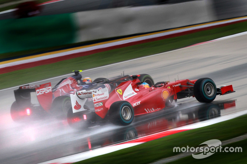 Fernando Alonso, Ferrari F2012, passes Jean-Eric Vergne, Toro Rosso STR7 Ferrari