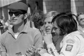 Peter Warr, Lotus Team Manager, Reine Wisell and Emerson Fittipaldi
