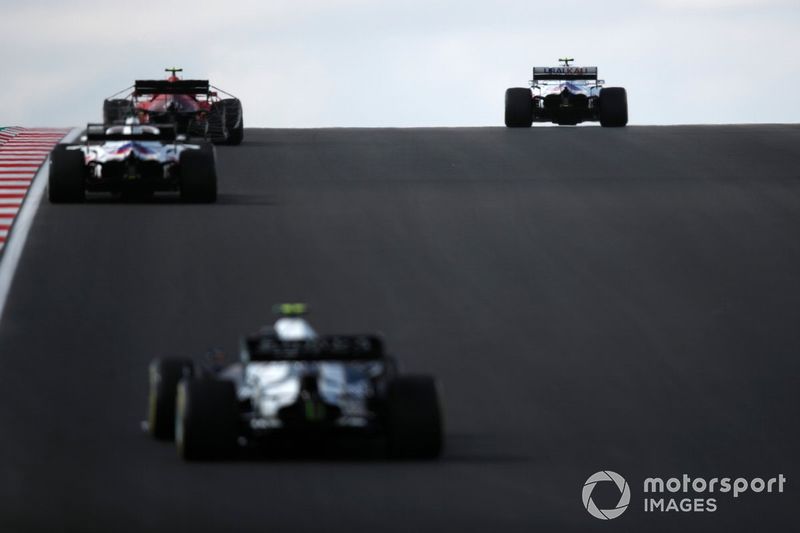 Mick Schumacher, Haas VF-21, Carlos Sainz Jr., Ferrari SF21, and Nikita Mazepin, Haas VF-21