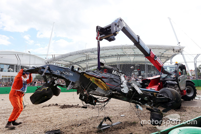 The McLaren MP4-31 of Fernando Alonso, McLaren is removed from the gravel trap after his race stopping crash